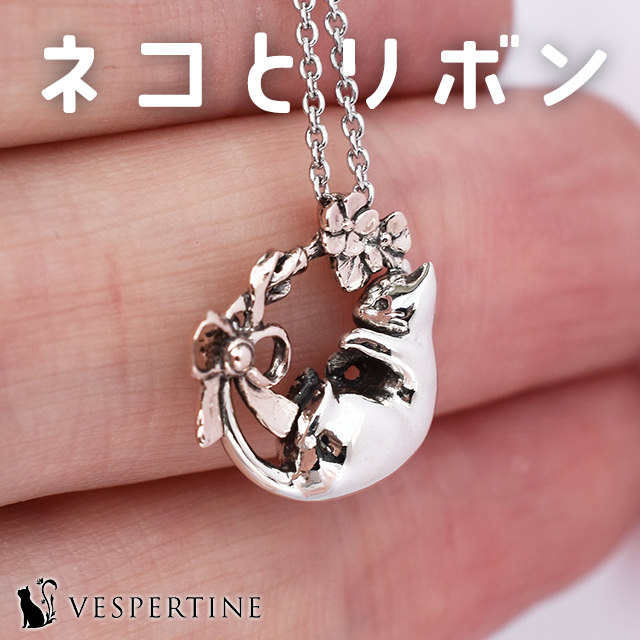 花とリボンと猫のネックレス